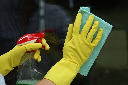 Cleaning staff following safe work practices with protective equipment