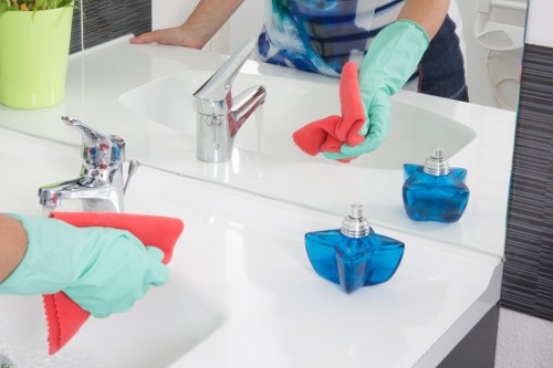 Routine home cleaning in an E14 kitchen and living area