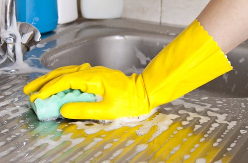 Local cleaner inspecting a mattress in a Canary Wharf area flat