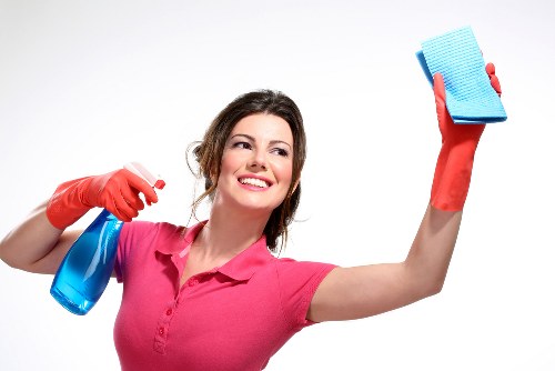 Cleaner handling chemical products safely during routine work