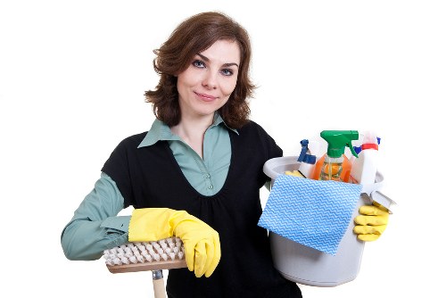 Upholstery cleaner treating a fabric sofa in East London